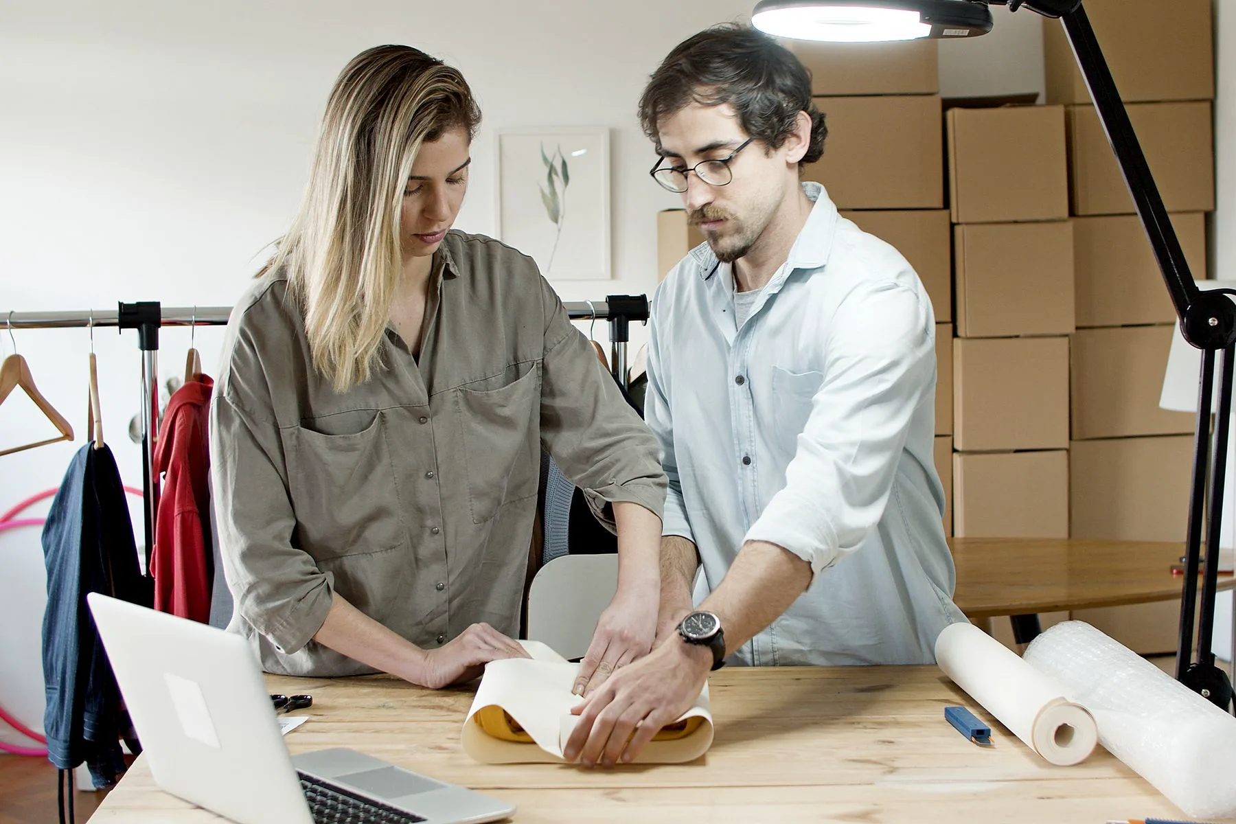 Two ecommerce operators preparing products for online fulfillment