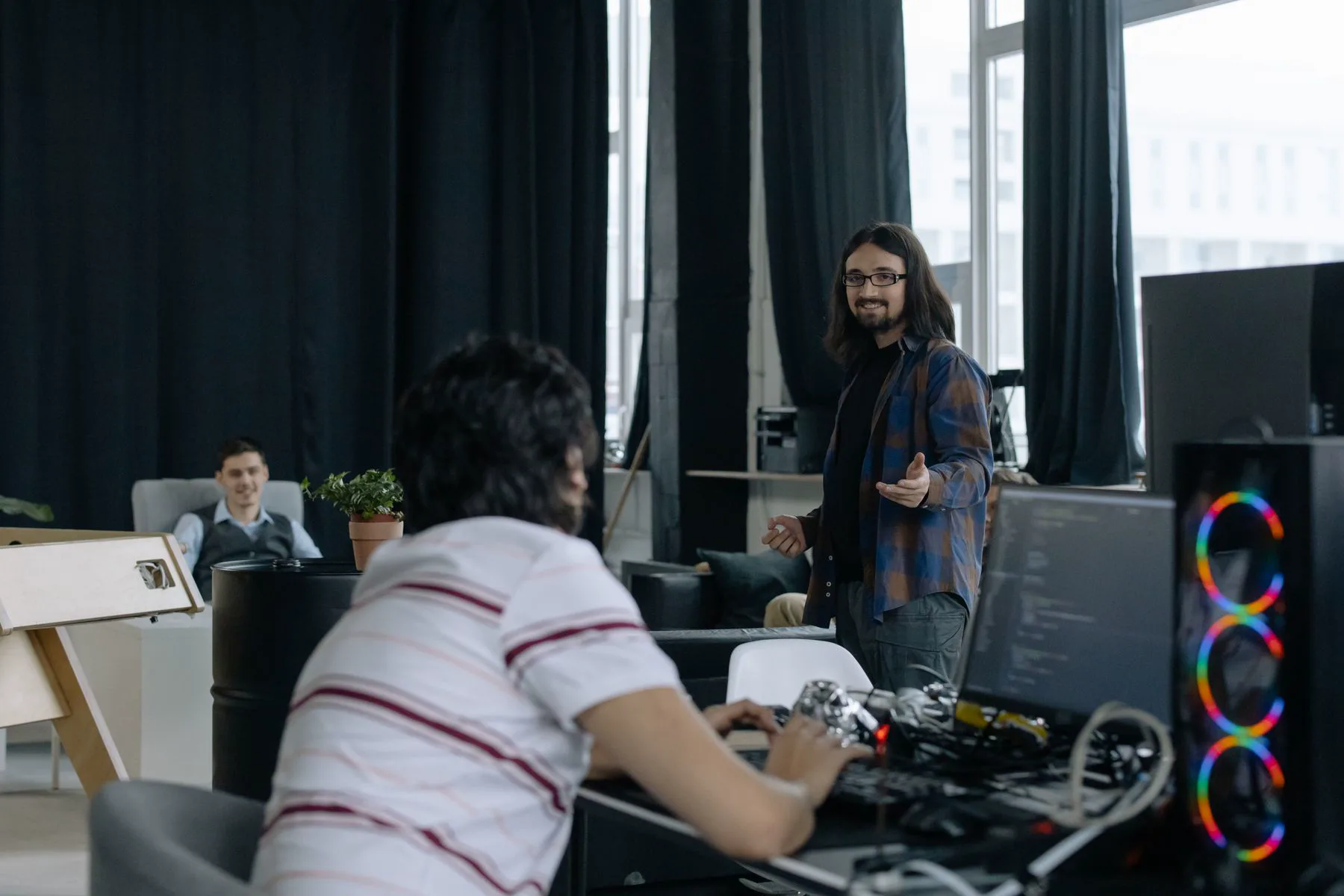 A software team collaborating in a real development studio